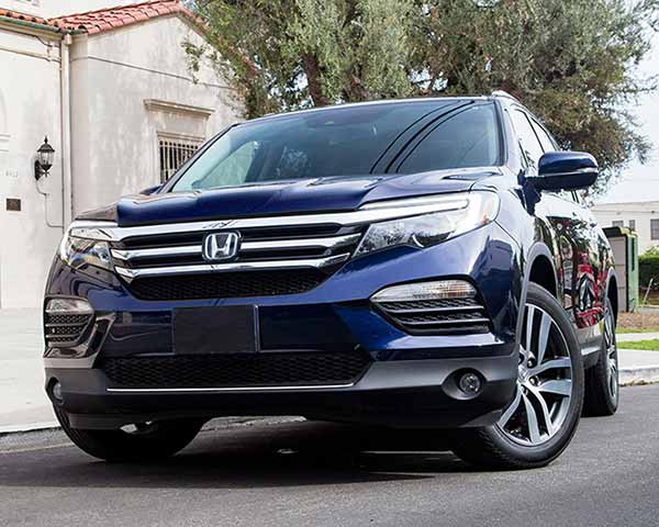Dark blue Honda Pilot SUV parked on a sunny street